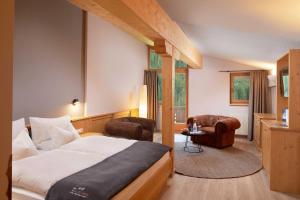 A bed or beds in a room at Adler Inn Tyrol Mountain Resort SUPERIOR