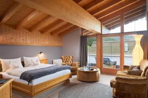 A bed or beds in a room at Adler Inn Tyrol Mountain Resort SUPERIOR