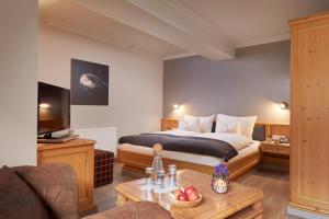 A bed or beds in a room at Adler Inn Tyrol Mountain Resort SUPERIOR