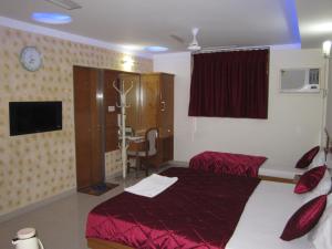 Hotel Sarita tesisinde bir odada yatak veya yataklar