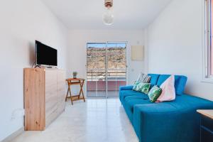 Televízia a/alebo spoločenská miestnosť v ubytovaní Home2Book Comfy Apt Puerto Rico, Pool&Terrace