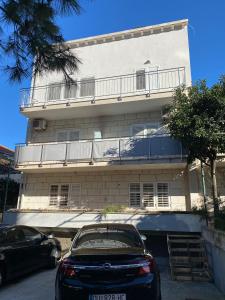 a car parked in front of a building at Rooms Jelena in Dubrovnik