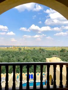 a view from a balcony with a view of the desert at Tunisia Castle Motel in Fayoum Center