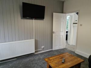 a living room with a tv on the wall at Eastgate Road in Middlesbrough