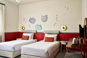 Postel nebo postele na pokoji v ubytování Turtle's Inn Hotel