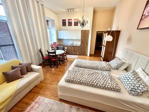 a living room with a couch and a table at Home Away central apartment in Poprad
