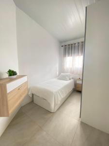 A bed or beds in a room at Villa Residencial El Guaidil