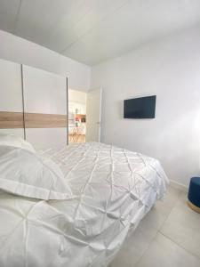 A bed or beds in a room at Villa Residencial El Guaidil