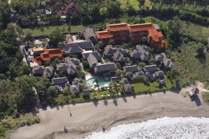 an aerial view of a resort on a beach at Balisani Suites Hotel in Seminyak