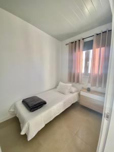 A bed or beds in a room at Villa Residencial El Guaidil
