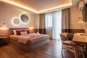 Posteľ alebo postele v izbe v ubytovaní Asteris Village