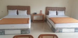 Postel nebo postele na pokoji v ubytování HOTEL CIPUNAGA