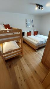 Postel nebo postele na pokoji v ubytování Ferienwohnung Ida inkl SommerCard