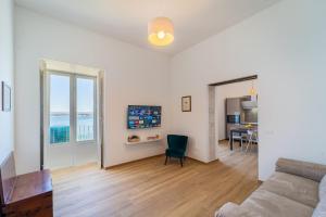 A kitchen or kitchenette at Ortigia Superior Sea View Apartment near Duomo