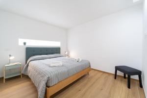 A bed or beds in a room at Ortigia Superior Sea View Apartment near Duomo