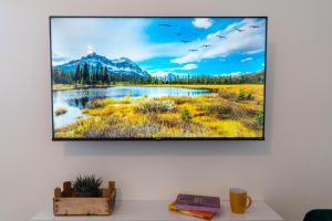 A television and/or entertainment centre at Ortigia Superior Sea View Apartment near Duomo