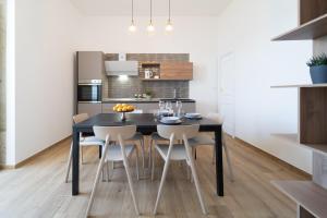 A kitchen or kitchenette at Ortigia Superior Sea View Apartment near Duomo