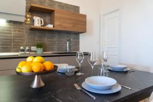 A kitchen or kitchenette at Ortigia Superior Sea View Apartment near Duomo