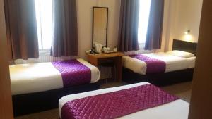 Postel nebo postele na pokoji v ubytování Arriva Hotel + 19 fotografií