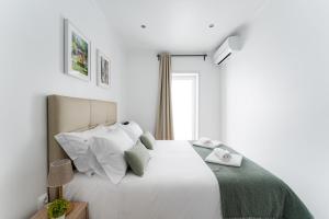 Uma cama ou camas num quarto em Casa Trindade
