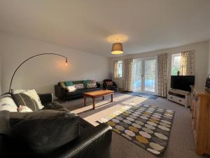 a living room with a couch and a table at Town House B in Dunston