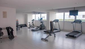 a gym with several exercise bikes in a room at Paiva Home Stay - Vista dos Sonhos in Recife