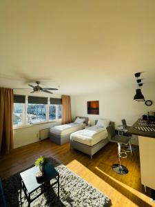 a living room with a couch and a table at Messe Apartment am Rhein in Cologne