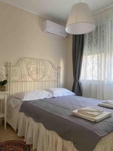 Ένα ή περισσότερα κρεβάτια σε δωμάτιο στο Ερέτρια ~Ένας προορισμός μια ανάσα από την Αθήνα