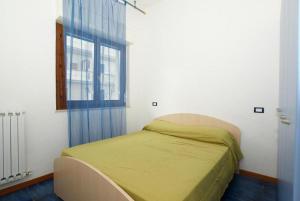 Säng eller sängar i ett rum på Appartamenti Alba Adriatica Viale Mazzini