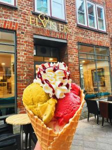 a large ice cream cone sitting on top of a table at Elvis Family Dream in Lübeck