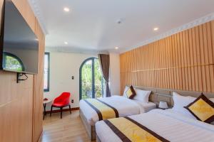 Postel nebo postele na pokoji v ubytování Anasia Hotel