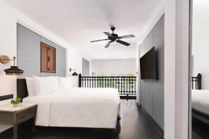 Ein Bett oder Betten in einem Zimmer der Unterkunft JW Marriott Khao Lak Resort and Spa
