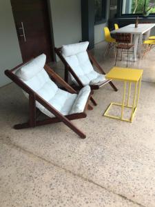 two chairs and a table in a room at BAA BAA RESIDENCE in Hillcrest