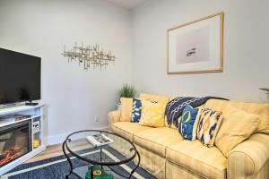 a living room with a couch and a tv at Modern Apt Near Marthas Vineyard Beaches! in Oak Bluffs