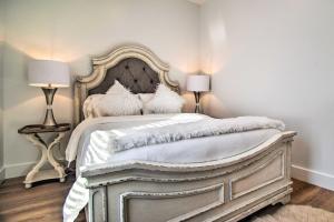 a bedroom with a white bed with two lamps at Modern Apt Near Marthas Vineyard Beaches! in Oak Bluffs