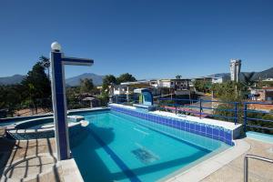 a large swimming pool on top of a building at Hotel Explora in Chachagüí