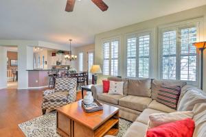 a living room with a couch and a table at Upscale Scottsdale Getaway with Golf Course Views! in Scottsdale