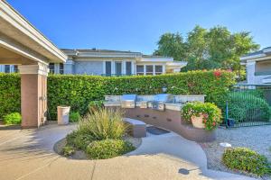 a house with a patio with chairs on a bridge at Upscale Scottsdale Getaway with Golf Course Views! in Scottsdale