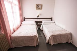 Postel nebo postele na pokoji v ubytování Hostal Venta Del Sol