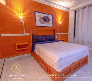 a bedroom with a large bed in a room at Alquería Central hotel in Tlaxco de Morelos