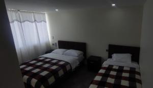Rúm í herbergi á Hotel Explora