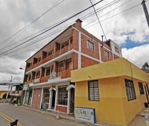 a building on the corner of a street at Lagoon Hotel Chugchilan in Chugchilán