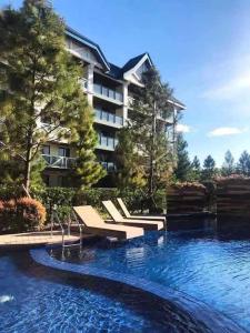 Πισίνα στο ή κοντά στο The GetAway Place @ Pine Suites
