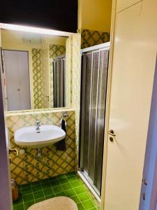 a bathroom with a sink and a mirror at Le Marine 4 in Cogolin