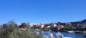 a group of boats docked in a river at Sandy Beach Studio in Lukoran