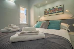 Postel nebo postele na pokoji v ubytování Stella by PortofinoHomes