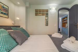 Postel nebo postele na pokoji v ubytování Stella by PortofinoHomes