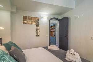 Postel nebo postele na pokoji v ubytování Stella by PortofinoHomes