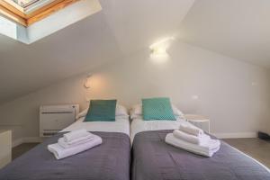 Postel nebo postele na pokoji v ubytování Stella by PortofinoHomes