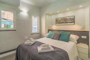 Postel nebo postele na pokoji v ubytování Stella by PortofinoHomes